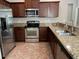 Kitchen with stainless steel appliances and granite countertops at 2126 Richwood Pike Dr, Ruskin, FL 33570
