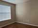 Bright bedroom with wood-look flooring and window blinds at 2126 Richwood Pike Dr, Ruskin, FL 33570