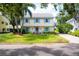 Charming two-story home with light yellow siding and blue shutters at 1229 S Roxmere Rd, Tampa, FL 33629