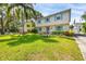 Charming two-story home with blue shutters and a well-manicured lawn and garden at 1229 S Roxmere Rd, Tampa, FL 33629
