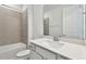 Bathroom with a tub, shower, white cabinets, and quartz countertops at 13719 Brookside Haven St, Riverview, FL 33578