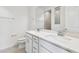 Bathroom featuring dual sinks, quartz counters, and modern fixtures at 13719 Brookside Haven St, Riverview, FL 33578