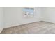 Cozy bedroom with neutral carpet and a bright window at 13719 Brookside Haven St, Riverview, FL 33578