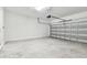 Spacious two-car garage with an automatic door and concrete floors at 13719 Brookside Haven St, Riverview, FL 33578
