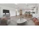 Open concept living space with modern furnishings and plenty of natural light at 13719 Brookside Haven St, Riverview, FL 33578