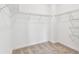 Walk-in closet with built-in shelving for organized storage at 13719 Brookside Haven St, Riverview, FL 33578