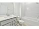 A full bathroom with a bathtub, shower, vanity, sink, and toilet at 13730 Evergreen Valley Dr, Riverview, FL 33578