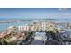 Stunning aerial view showcasing waterfront property, beautiful beaches, and vibrant neighborhood at 241 Skiff Pt # 4, Clearwater Beach, FL 33767