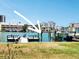 Waterfront home featuring a dock and boat lift, with seating and Gulf views at 241 Skiff Pt # 4, Clearwater Beach, FL 33767