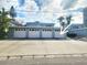 Four-car garage providing ample parking space for a waterfront home at 241 Skiff Pt # 4, Clearwater Beach, FL 33767