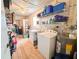 Laundry room includes washer, dryer, shelving, and extra storage at 216 Gloucester Blvd # 216, Sun City Center, FL 33573