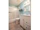 Bathroom with white vanity, tile flooring, and shower/tub combo at 216 Gloucester Blvd # 216, Sun City Center, FL 33573