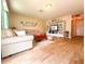 Bright living room with tile floors, comfy sofas, and a large entertainment center at 216 Gloucester Blvd # 216, Sun City Center, FL 33573