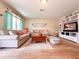 Spacious living room featuring tile floors and ample seating at 216 Gloucester Blvd # 216, Sun City Center, FL 33573