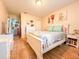 Bright bedroom with white dresser and double bed at 216 Gloucester Blvd # 216, Sun City Center, FL 33573