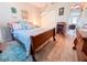 Bedroom with wooden sleigh bed and ample closet space at 216 Gloucester Blvd # 216, Sun City Center, FL 33573