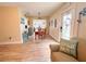 Dining area with a wooden table and chairs, view of kitchen at 216 Gloucester Blvd # 216, Sun City Center, FL 33573