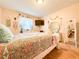 Bedroom with a double bed, dresser, and large mirror at 216 Gloucester Blvd # 216, Sun City Center, FL 33573