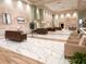 Elegant community clubhouse lobby with marble flooring and comfortable seating at 216 Gloucester Blvd # 216, Sun City Center, FL 33573