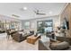 Spacious living room with comfortable seating and access to a patio at 10012 Corso Milano Dr, Tampa, FL 33625