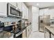 Sleek kitchen with stainless steel appliances and granite countertops at 10012 Corso Milano Dr, Tampa, FL 33625