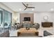 Spacious living area with a wooden coffee table and access to a patio at 10012 Corso Milano Dr, Tampa, FL 33625