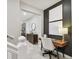 Home office with a desk, chair, and stylish artwork at 10012 Corso Milano Dr, Tampa, FL 33625