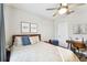 Serene bedroom with a queen bed and a workspace at 10012 Corso Milano Dr, Tampa, FL 33625