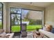 Peaceful screened patio with seating and fire pit at 10012 Corso Milano Dr, Tampa, FL 33625