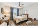 Cozy bedroom featuring a queen bed and a work desk at 10012 Corso Milano Dr, Tampa, FL 33625