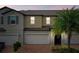 Two-story townhome with attached garage and brick driveway at 10012 Corso Milano Dr, Tampa, FL 33625