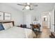 Relaxing bedroom with a queen bed and access to a hallway at 10012 Corso Milano Dr, Tampa, FL 33625