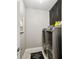 Bright laundry room with washer, dryer, and cabinets at 10012 Corso Milano Dr, Tampa, FL 33625