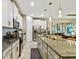 Open concept kitchen boasting granite counters and stainless steel appliances at 10012 Corso Milano Dr, Tampa, FL 33625