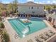 L-shaped community pool with lounge chairs and umbrellas at 10012 Corso Milano Dr, Tampa, FL 33625