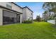 Spacious backyard with grassy area and privacy fence at 10012 Corso Milano Dr, Tampa, FL 33625