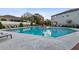 Community pool with lounge chairs and umbrellas at 10012 Corso Milano Dr, Tampa, FL 33625