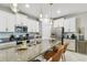 Modern kitchen with white cabinets, granite countertops and a large island with seating at 10012 Corso Milano Dr, Tampa, FL 33625