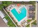 Aerial view of a community pool with lounge chairs and a hot tub at 10012 Corso Milano Dr, Tampa, FL 33625