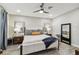 Spacious bedroom with large bed, stylish decor, and wood-look floors at 10012 Corso Milano Dr, Tampa, FL 33625
