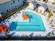Community pool with ample lounge chairs and orange umbrellas at 10012 Corso Milano Dr, Tampa, FL 33625