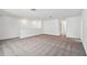 Spacious loft area with grey carpeting at 13728 Evergreen Valley Dr, Riverview, FL 33578