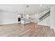 Open living space with kitchen, island, and hardwood floors at 13728 Evergreen Valley Dr, Riverview, FL 33578