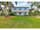 Two-story house with light yellow siding and blue shutters at 1229 S Roxmere Rd, Tampa, FL 33629