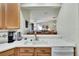 Kitchen with breakfast bar and view to living room at 242 Shell Falls Dr, Apollo Beach, FL 33572