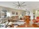 Comfortable living room with hardwood floors, plush seating, and a ceiling fan at 242 Shell Falls Dr, Apollo Beach, FL 33572