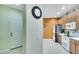 Bright kitchen with orange accent wall at 242 Shell Falls Dr, Apollo Beach, FL 33572