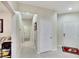 Neutral hallway with tile flooring and access to multiple rooms at 242 Shell Falls Dr, Apollo Beach, FL 33572