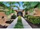 Walkway with tropical landscaping at 242 Shell Falls Dr, Apollo Beach, FL 33572