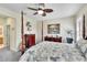 Spacious bedroom with a post bed, dresser, and ceiling fan at 242 Shell Falls Dr, Apollo Beach, FL 33572